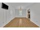 Bright dining room features hardwood floors, neutral walls, and a modern chandelier at 1198 Shining Water Ln, Creedmoor, NC 27522