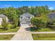 Charming two-story home featuring a well-maintained lawn and a long driveway leading to a two-car garage at 1198 Shining Water Ln, Creedmoor, NC 27522