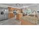 Bright kitchen boasting stainless steel appliances, granite countertops, and an island with seating at 1198 Shining Water Ln, Creedmoor, NC 27522