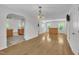Spacious living area with hardwood floors, white walls, and an open floor plan at 1198 Shining Water Ln, Creedmoor, NC 27522