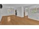 Open living room boasts hardwood floors, neutral walls and abundant natural light at 1198 Shining Water Ln, Creedmoor, NC 27522