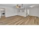 Open living room features modern flooring, ceiling fan, and neutral paint tones at 1198 Shining Water Ln, Creedmoor, NC 27522