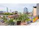 Charming balcony overlooking the city with comfortable seating and potted plants at 130 Hunt St # 107, Durham, NC 27701