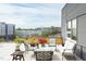 Inviting balcony seating area with open views of the surrounding city at 130 Hunt St # 107, Durham, NC 27701