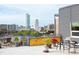 Relaxing balcony with city views and outdoor seating at 130 Hunt St # 107, Durham, NC 27701