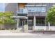 Modern building entrance with well-maintained landscaping and clear signage at 130 Hunt St # 107, Durham, NC 27701