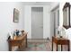 Charming entryway with antique furniture and a colorful rug at 130 Hunt St # 107, Durham, NC 27701