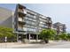 Modern condo building with balconies and lots of windows in an urban setting at 130 Hunt St # 107, Durham, NC 27701