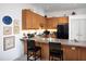 Cozy kitchen with bar stool seating and modern appliances at 130 Hunt St # 107, Durham, NC 27701