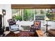 Cozy living area with large windows, comfortable seating, and vintage decor at 130 Hunt St # 107, Durham, NC 27701