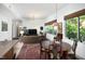 Open-concept living area with hardwood floors and lots of natural light at 130 Hunt St # 107, Durham, NC 27701