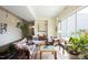 Bright living room with large windows and comfortable, colorful seating area at 130 Hunt St # 107, Durham, NC 27701