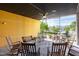 Relaxing outdoor patio with rocking chairs, hanging swing, and fan at 130 Hunt St # 107, Durham, NC 27701