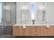 Bathroom featuring double vanity with modern fixtures, spacious walk-in shower, and ample natural light at 1302 Chamblee Hill Ct, Raleigh, NC 27608