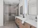 Modern bathroom with double vanity, contemporary fixtures, and a spacious walk-in shower at 1302 Chamblee Hill Ct, Raleigh, NC 27608