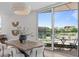 Modern dining area with a stylish light fixture and an inviting balcony at 1302 Chamblee Hill Ct, Raleigh, NC 27608