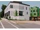 Modern home with white brick, large windows, and street view at 1302 Chamblee Hill Ct, Raleigh, NC 27608