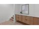 Hallway with built-in cabinets and stairs leading to the upper level of the home at 1302 Chamblee Hill Ct, Raleigh, NC 27608