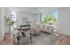 Cozy living room filled with natural light, comfortable seating, and modern decor at 1302 Chamblee Hill Ct, Raleigh, NC 27608