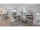Open-concept living space with hardwood floors, modern decor, and access to the dining area at 1302 Chamblee Hill Ct, Raleigh, NC 27608