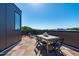 Rooftop deck featuring a dining area and views of the surrounding city at 1302 Chamblee Hill Ct, Raleigh, NC 27608