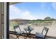 Cozy balcony with outdoor seating and a view of the surrounding neighborhood at 1303 Chamblee Hill Ct, Raleigh, NC 27608