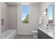 Bright bathroom featuring shower over tub and modern vanity at 1303 Chamblee Hill Ct, Raleigh, NC 27608