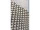 Close-up of the white brick detail with a textured, geometric pattern, showcasing the exterior craftsmanship at 1303 Chamblee Hill Ct, Raleigh, NC 27608