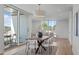 Elegant dining area with a large table, stylish chairs, and access to the patio at 1303 Chamblee Hill Ct, Raleigh, NC 27608