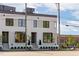 Modern white brick home with black framed windows and manicured landscaping at 1303 Chamblee Hill Ct, Raleigh, NC 27608