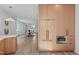 Open-concept kitchen with wood cabinets, built-in oven, and easy access to the dining area at 1303 Chamblee Hill Ct, Raleigh, NC 27608