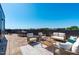 Spacious rooftop patio with comfortable seating and stunning city views at 1303 Chamblee Hill Ct, Raleigh, NC 27608