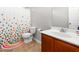 Bathroom with tile flooring, a vanity, and a shower featuring a colorful shower curtain at 1307 Torrey Pines Ct, Mebane, NC 27302