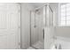Bright bathroom with glass enclosed shower and a separate bathtub at 1307 Torrey Pines Ct, Mebane, NC 27302