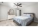 Bedroom with neutral paint, light carpet, and a dresser with mirror at 1307 Torrey Pines Ct, Mebane, NC 27302
