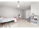 Brightly lit bedroom featuring neutral carpet, a light fixture and a closet with double doors at 1307 Torrey Pines Ct, Mebane, NC 27302