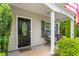 Cozy front porch with seating, a decorative door, and well-maintained plants at 1307 Torrey Pines Ct, Mebane, NC 27302