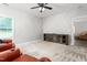 Relaxing living room with carpeting, ceiling fan and an entertainment center at 1307 Torrey Pines Ct, Mebane, NC 27302