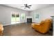Bright living room with fireplace, sliding glass door, and hardwood floors at 1307 Torrey Pines Ct, Mebane, NC 27302