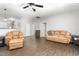 Spacious living room with hardwood floors, comfortable seating, and ample natural light at 1307 Torrey Pines Ct, Mebane, NC 27302