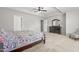 This primary bedroom features a tray ceiling, neutral carpet and ample lighting at 1307 Torrey Pines Ct, Mebane, NC 27302