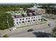 Aerial view of modern townhomes with rooftop decks and green spaces, located near urban amenities at 1308 Chamblee Hill Ct, Raleigh, NC 27608