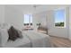 Cozy bedroom with a large bed, soft pillows, and natural light from multiple windows at 1308 Chamblee Hill Ct, Raleigh, NC 27608