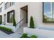 Chic townhouse entrance featuring well manicured landscaping and contemporary architectural design at 1308 Chamblee Hill Ct, Raleigh, NC 27608