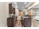 Basement with bar featuring custom wood cabinets and wood floors at 1308 Green Oaks Pkwy, Holly Springs, NC 27540