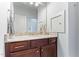 Bathroom featuring a sink with granite countertops and dark wood cabinets at 1308 Green Oaks Pkwy, Holly Springs, NC 27540