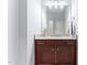 Bathroom featuring a sink with granite countertops and dark wood cabinets at 1308 Green Oaks Pkwy, Holly Springs, NC 27540