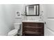 Bathroom featuring a sink, a toilet and wood floors at 1308 Green Oaks Pkwy, Holly Springs, NC 27540