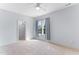 Bright bedroom with a window and closet with shelving at 1308 Green Oaks Pkwy, Holly Springs, NC 27540