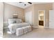 Comfortable main bedroom features plush carpeting and ensuite bathroom access at 1308 Green Oaks Pkwy, Holly Springs, NC 27540